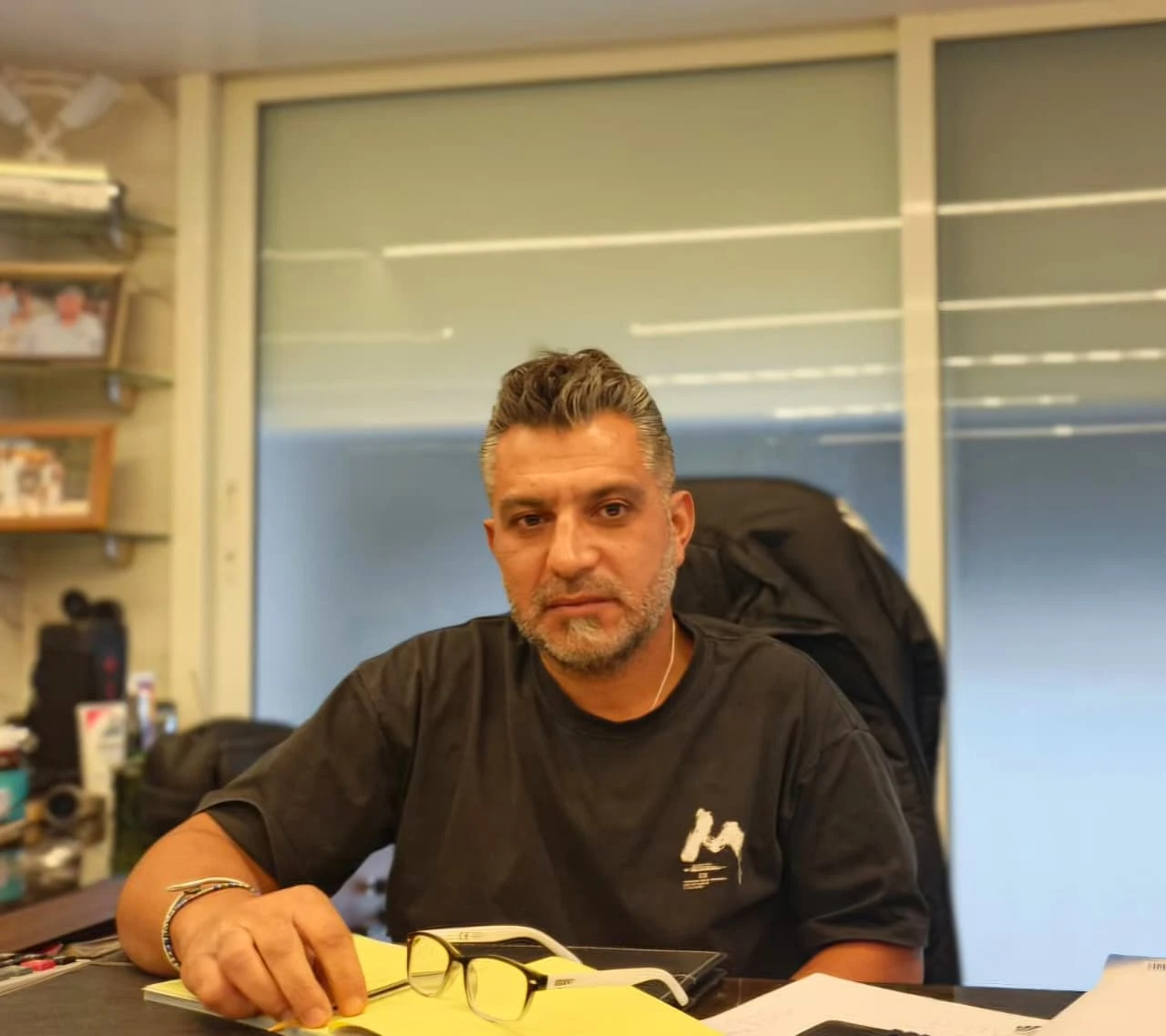 Nader Osta seated at his desk